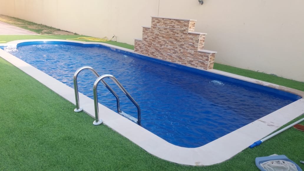 Residential pool with a wide tiled surround